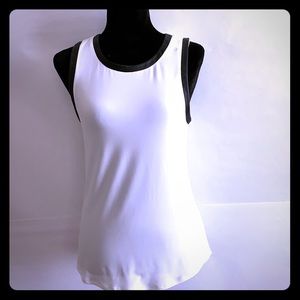 White blouse with leather trim.